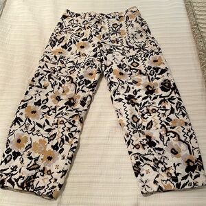 Anthropologie brushed cords in brown and yellow print.